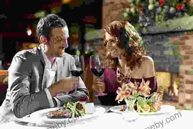 A Couple Sharing A Romantic Dinner At A Restaurant Delancey: A Man A Woman A Restaurant A Marriage