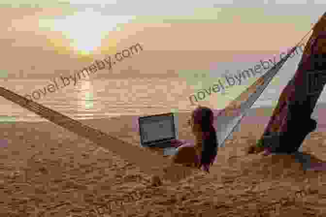 A Person Working On A Laptop While Sitting On A Beach, Surrounded By A Breathtaking Ocean View. BE A NOMAD CHANGE YOUR LIFE: The ULTIMATE GUIDE To Living Full Time In A Van Or RV