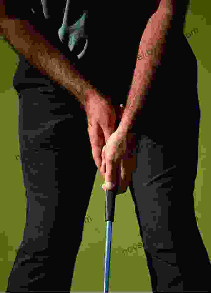 Close Up Of A Golfer's Hands Gripping A Putter The Little Of Putting