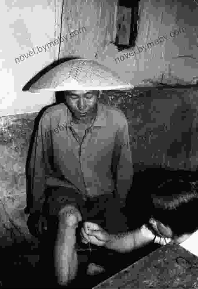 Dr. Nguyen Van Chau, The Barefoot Doctor In Vietnam, Treating Patients In A Makeshift Clinic During The War Fourth Uncle In The Mountain: A Memoir Of A Barefoot Doctor In Vietnam