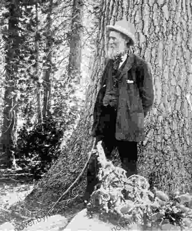 John Muir Standing On The Bank Of A Serene River In The Alaskan Wilderness. Wilderness: A Journal Of Quiet Adventure In Alaska