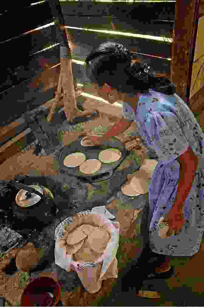 Traditional Mayan Woman Preparing Food Using Ancient Techniques, Showcasing The Cultural Significance Of Belizean Cuisine Taste Of Belize: A Food Travel Guide