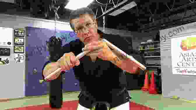 Two Practitioners Engaged In Nunchaku Training, Showcasing Their Agility And Combat Prowess Weapons (Discover Series) Xist Publishing